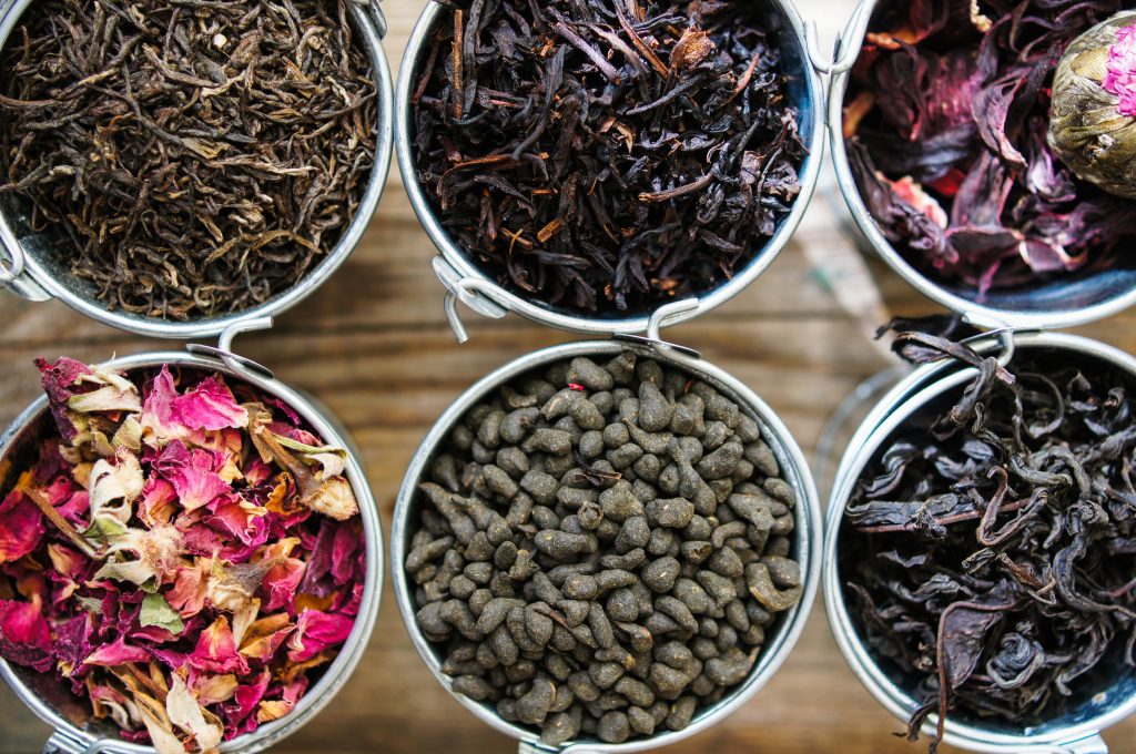 Different types of loose leaf tea in open tins
