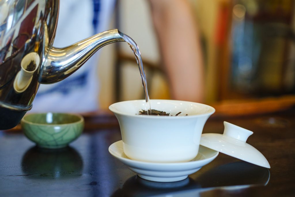 Water being poured into a gaiwan