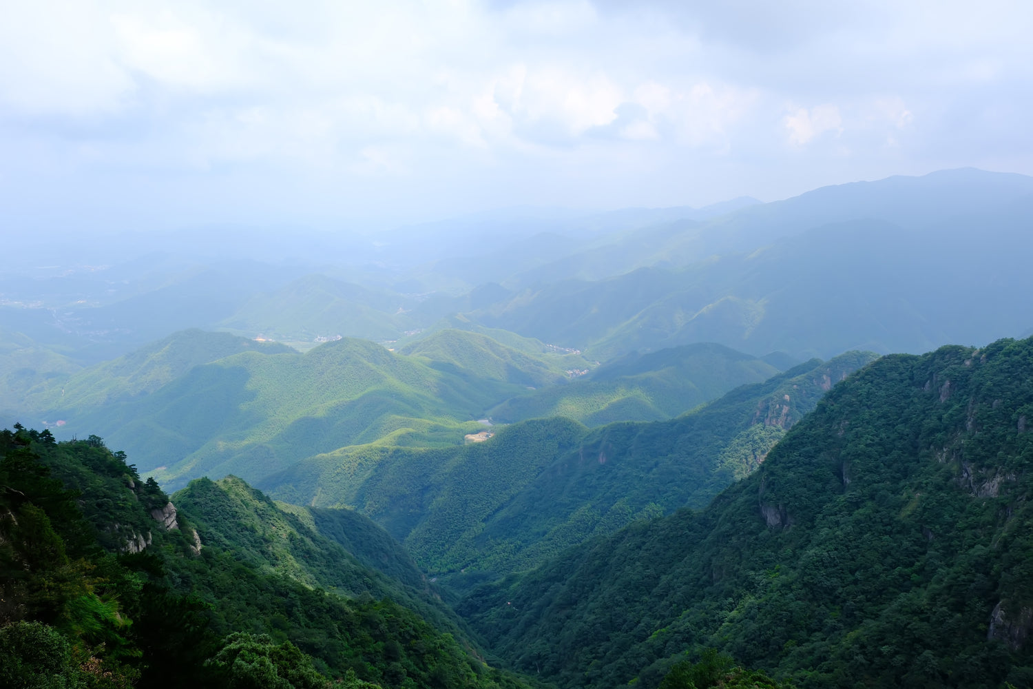 a scenic view of mountains in anji county